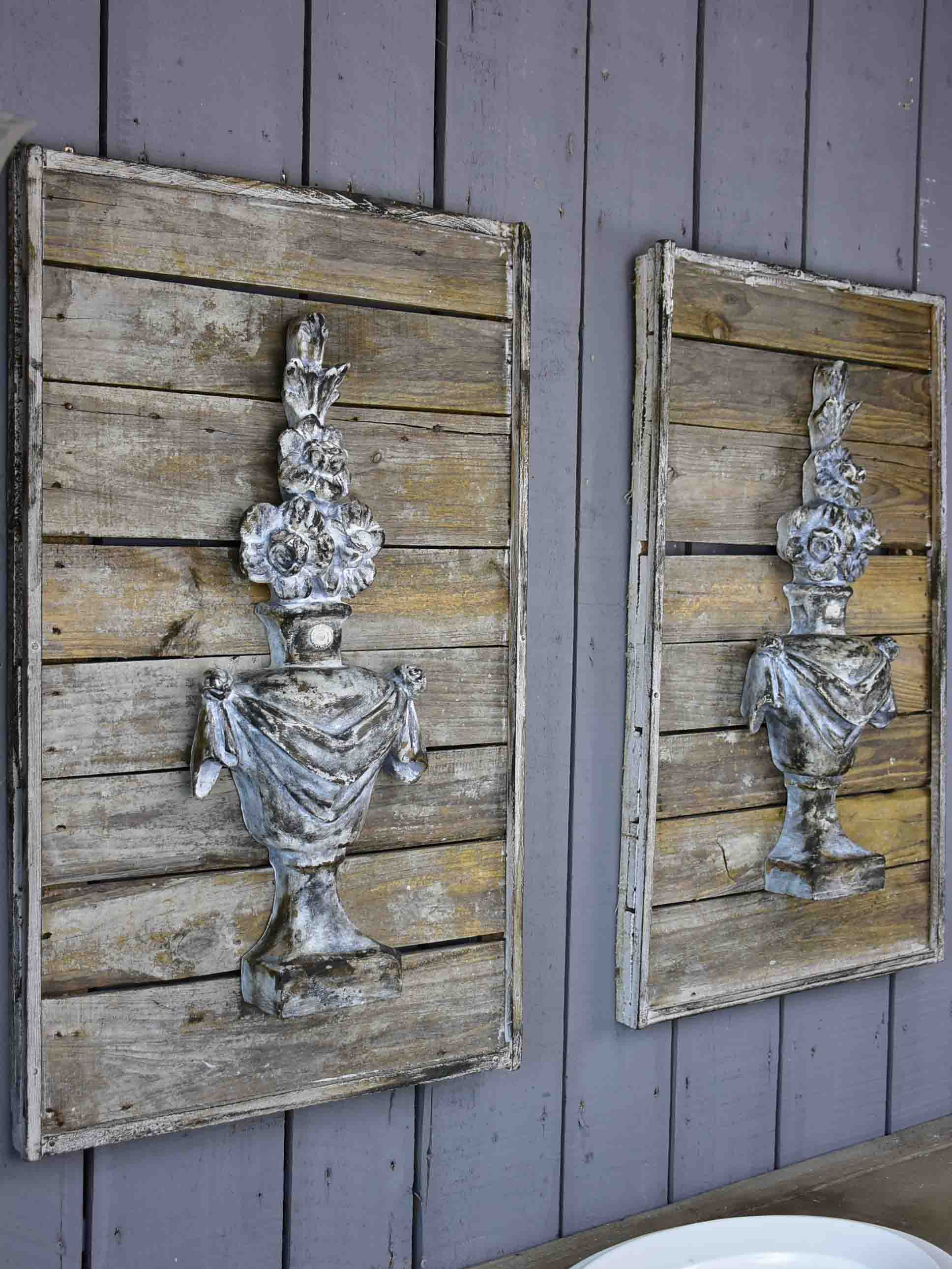 Pair of rustic French wall panels with flower urns