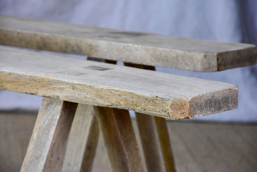 Pair of rustic antique French benches with splayed feet