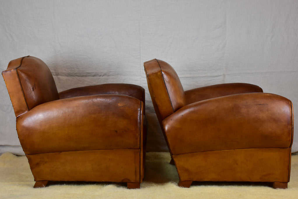 Pair of large mustache back vintage French club chairs