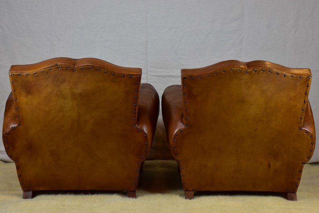 Pair of large mustache back vintage French club chairs