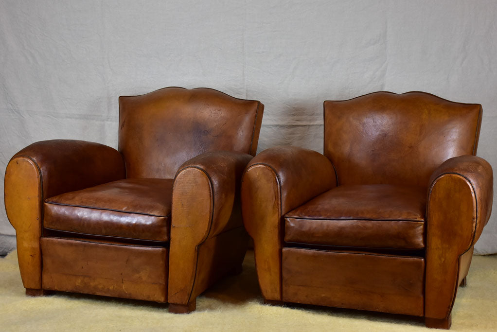 Pair of large mustache back vintage French club chairs