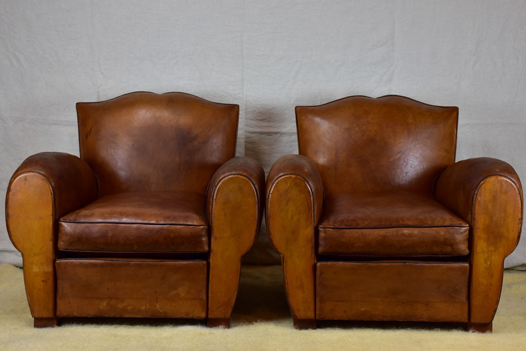 Pair of large mustache back vintage French club chairs