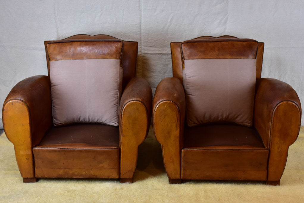 Pair of large mustache back vintage French club chairs