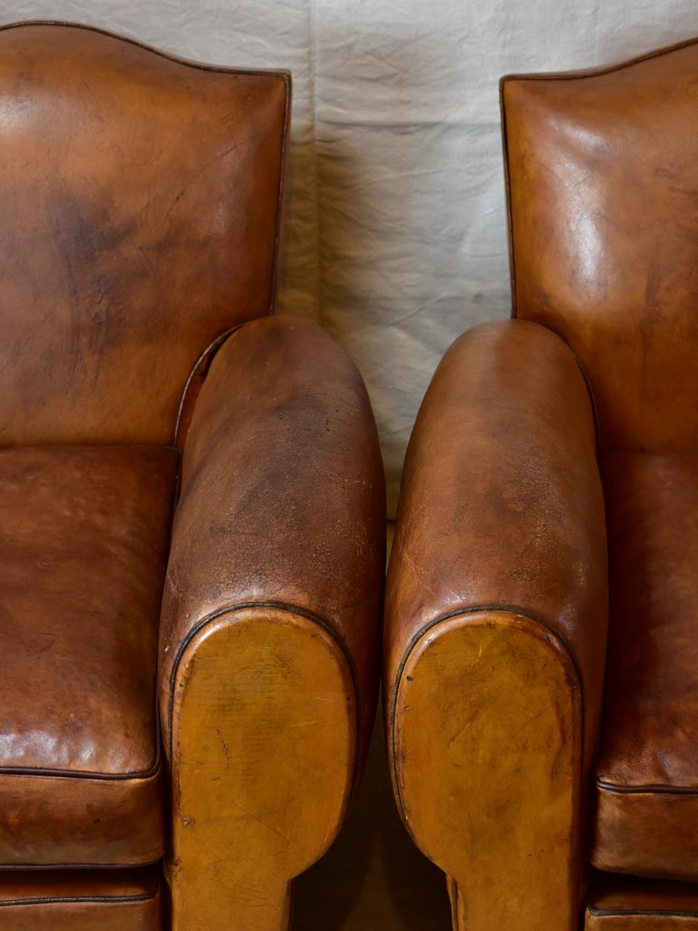 Pair of large mustache back vintage French club chairs