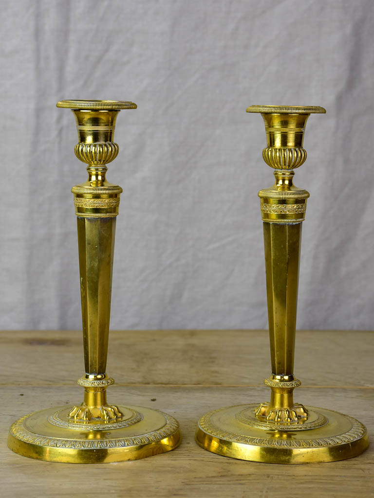 Pair of early 19th Century bronze candlesticks with claw feet