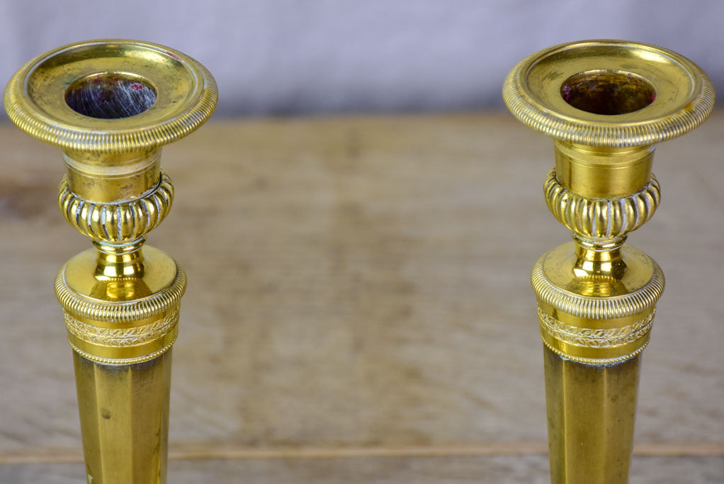 Pair of early 19th Century bronze candlesticks with claw feet