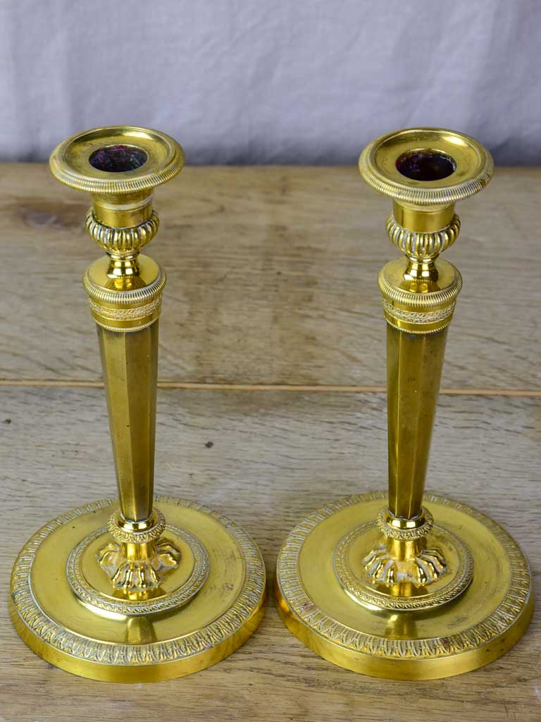 Pair of early 19th Century bronze candlesticks with claw feet