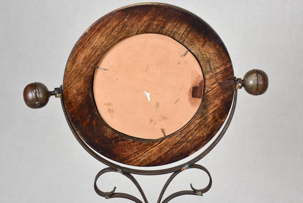 Small round tilting vanity mirror