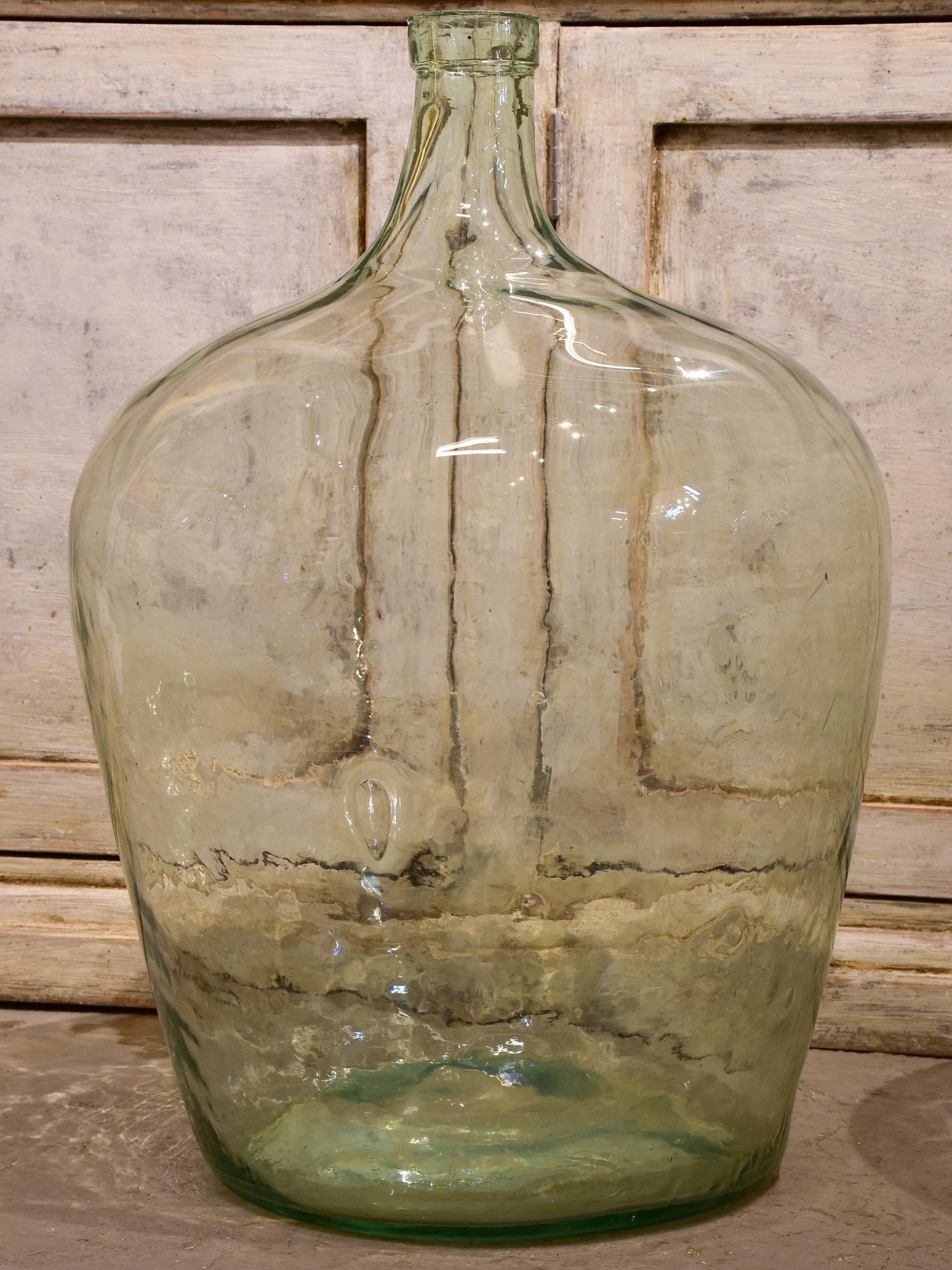 Pair of antique demijohn bottles