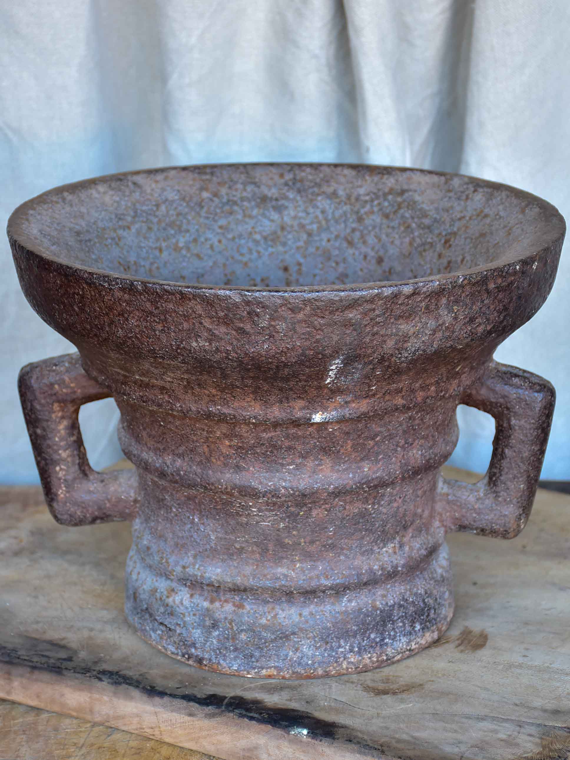 Antique iron mortar with bracket arms - European