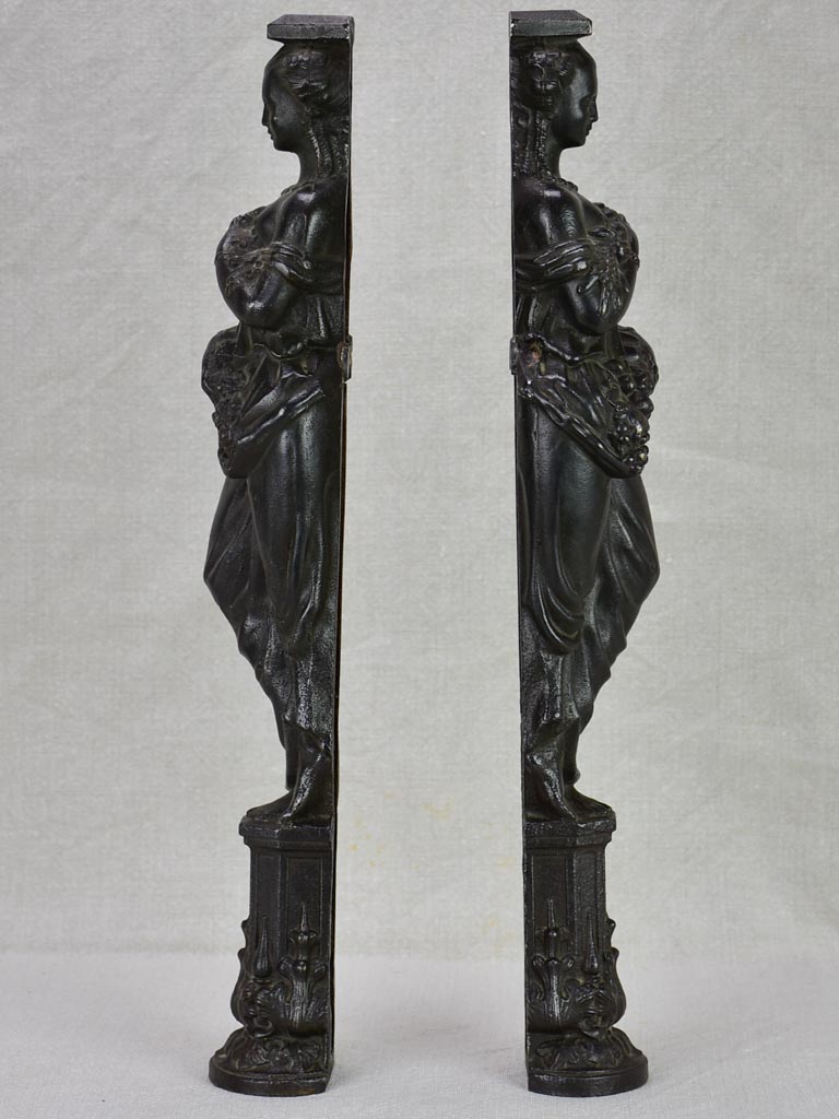 Pair of cast iron elements from a piece of furniture - caryatids 17¾"