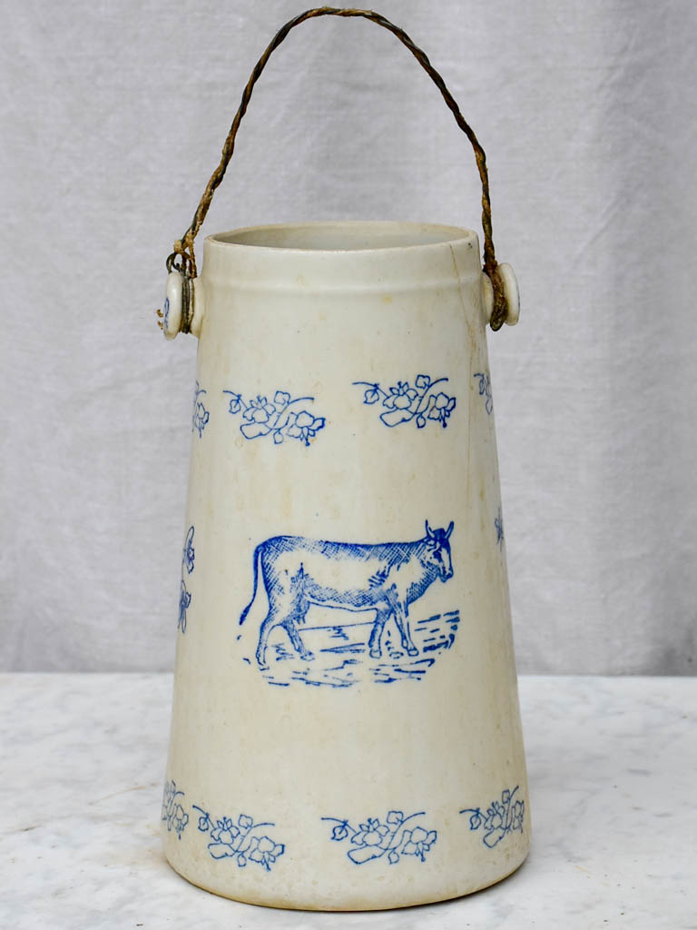 Antique French milk pitcher with cow and flowers