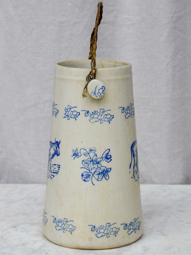 Antique French milk pitcher with cow and flowers