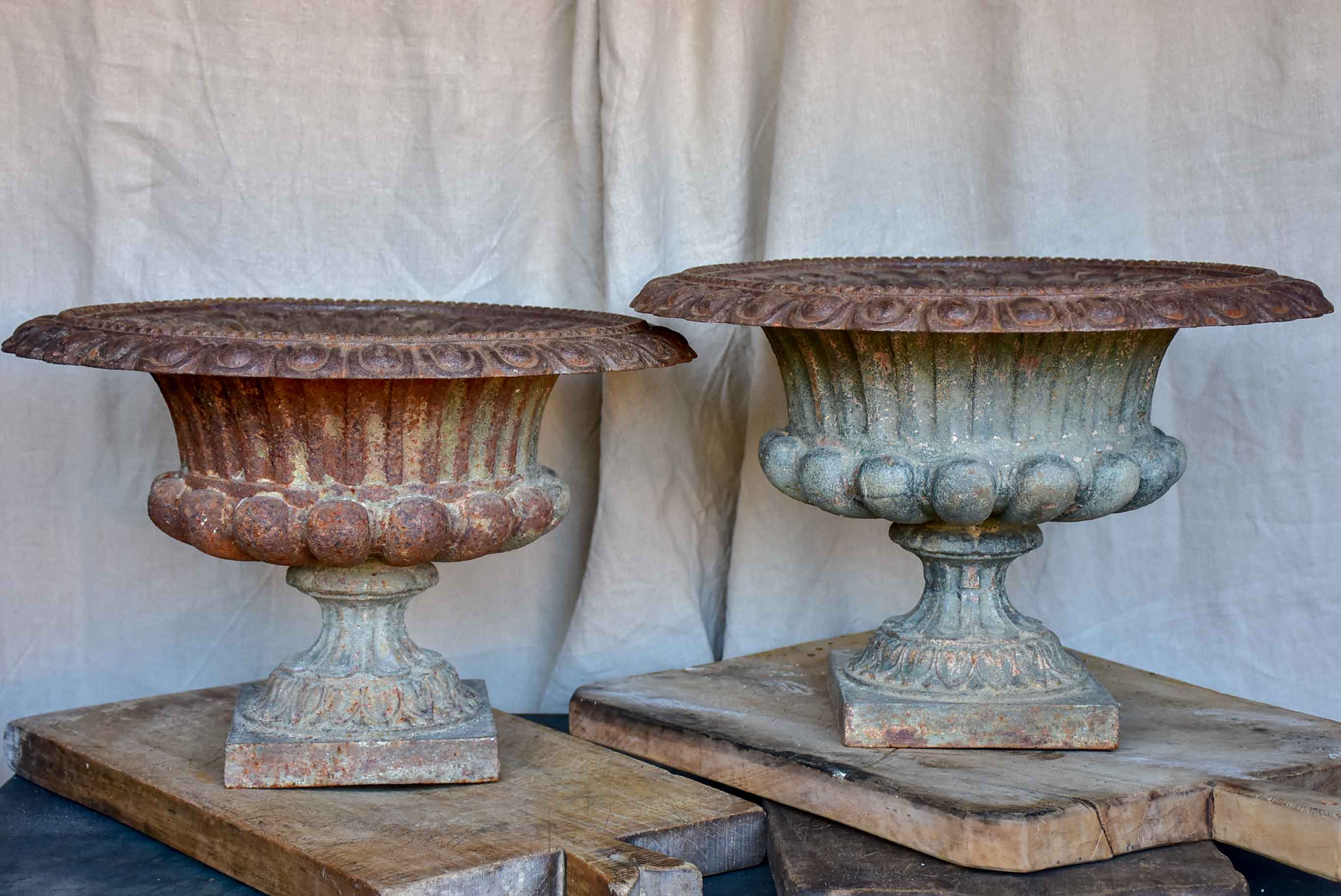 Pair of antique French cast iron urns