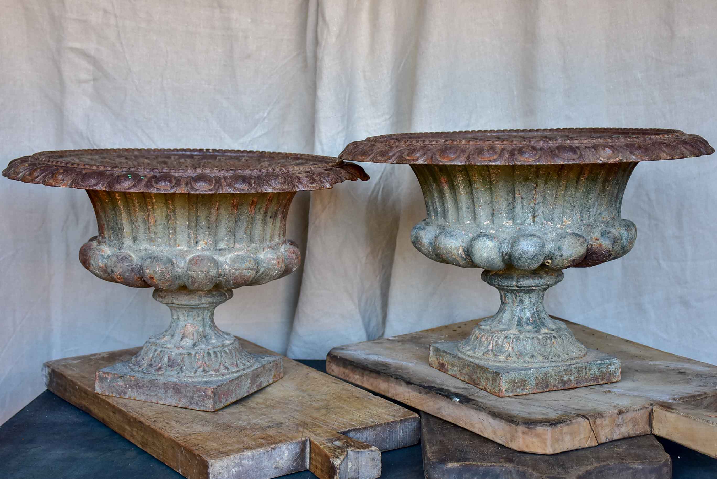 Pair of antique French cast iron urns