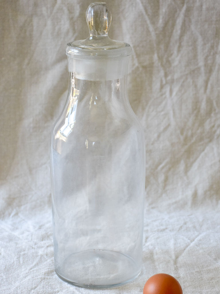 Antique French apothecary glass bottle with lid