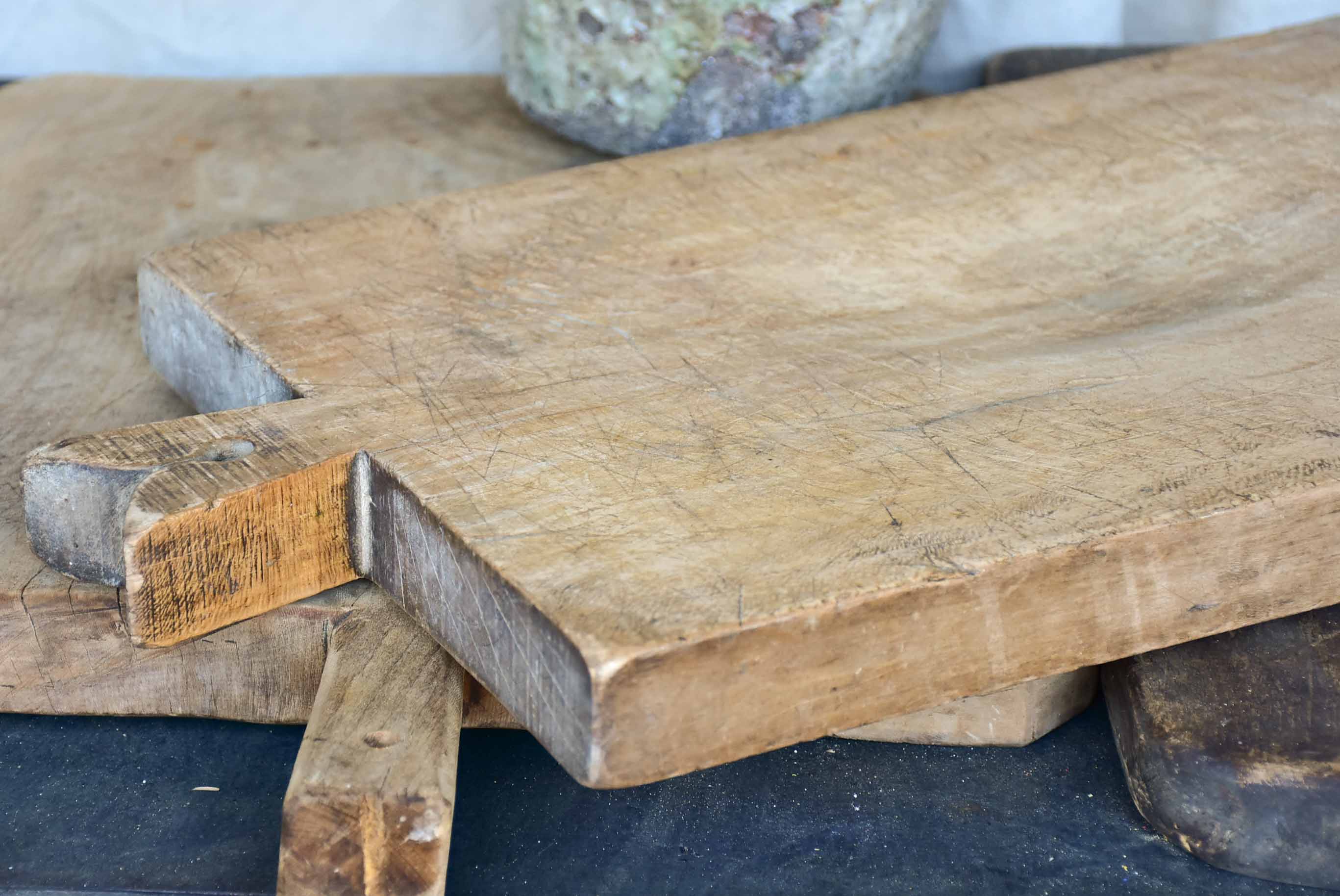 Very large antique French cutting board with fishtail handle