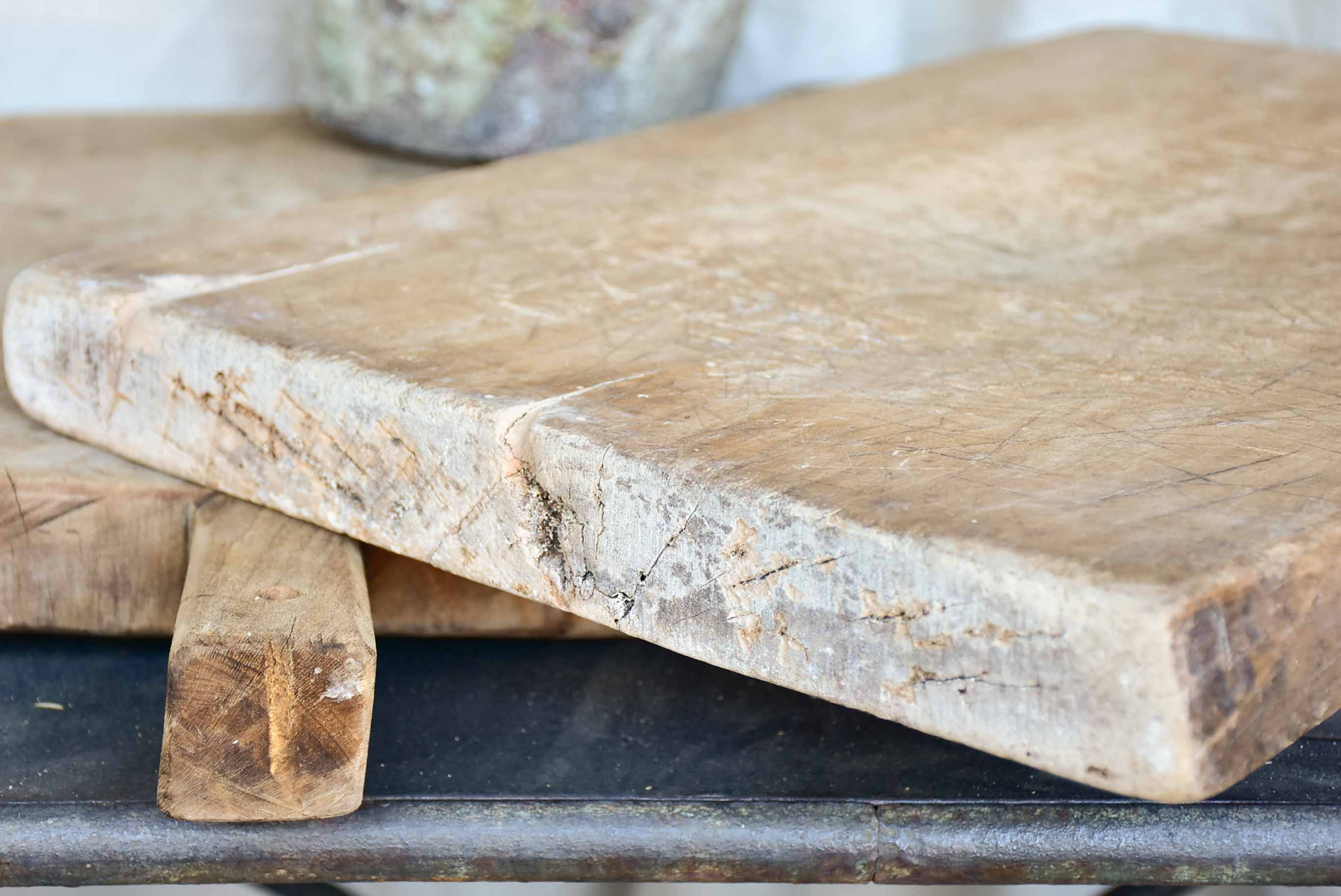 Very large antique French cutting board with fishtail handle