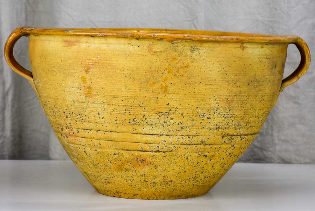 Very large antique Spanish bowl with orange glaze