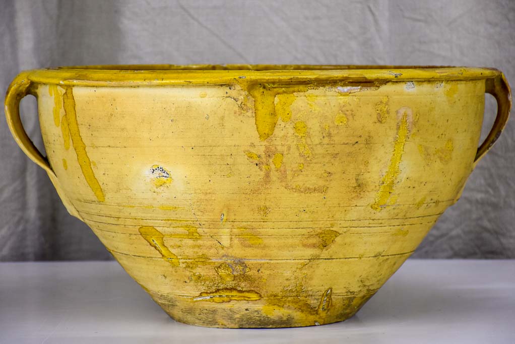 Large antique Spanish bowl with yellow glaze