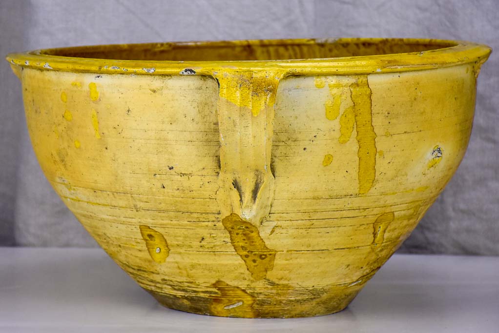 Large antique Spanish bowl with yellow glaze