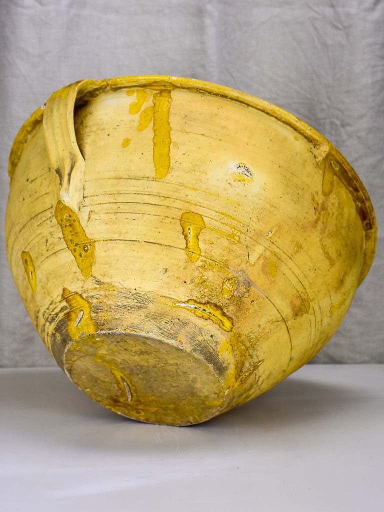 Large antique Spanish bowl with yellow glaze