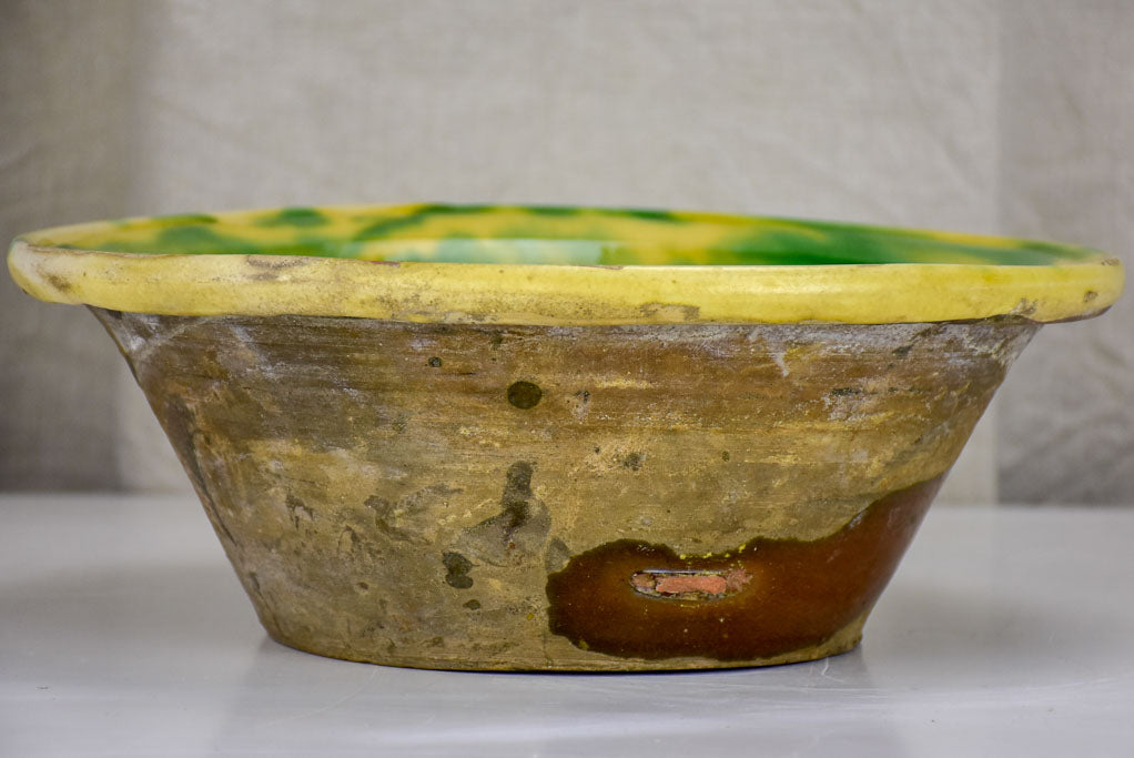 Antique Spanish bowl with yellow and green glaze