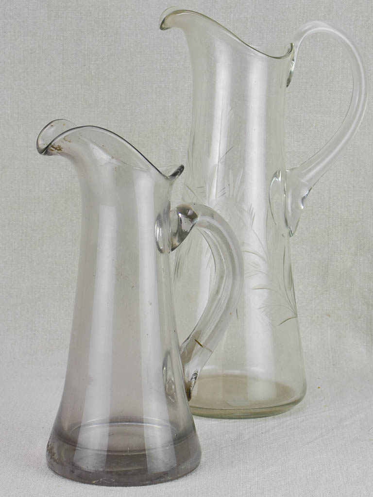 Two blown glass bistro cider pitchers