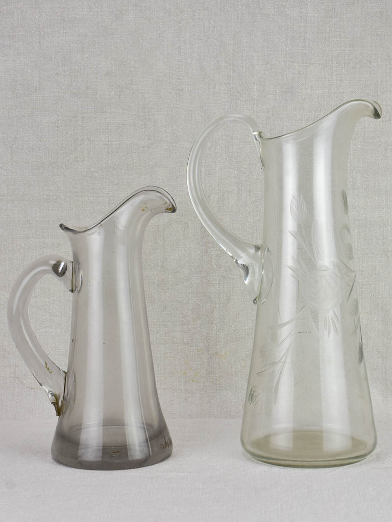 Two blown glass bistro cider pitchers