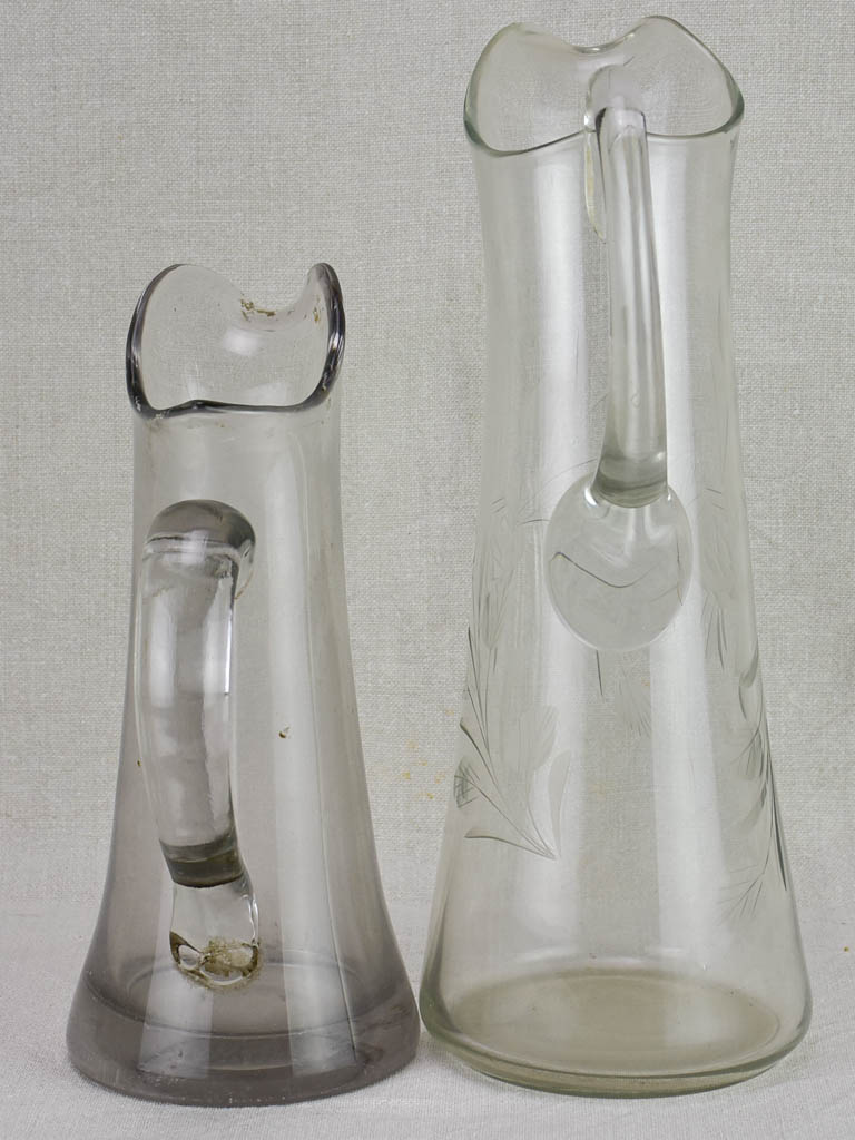 Two blown glass bistro cider pitchers