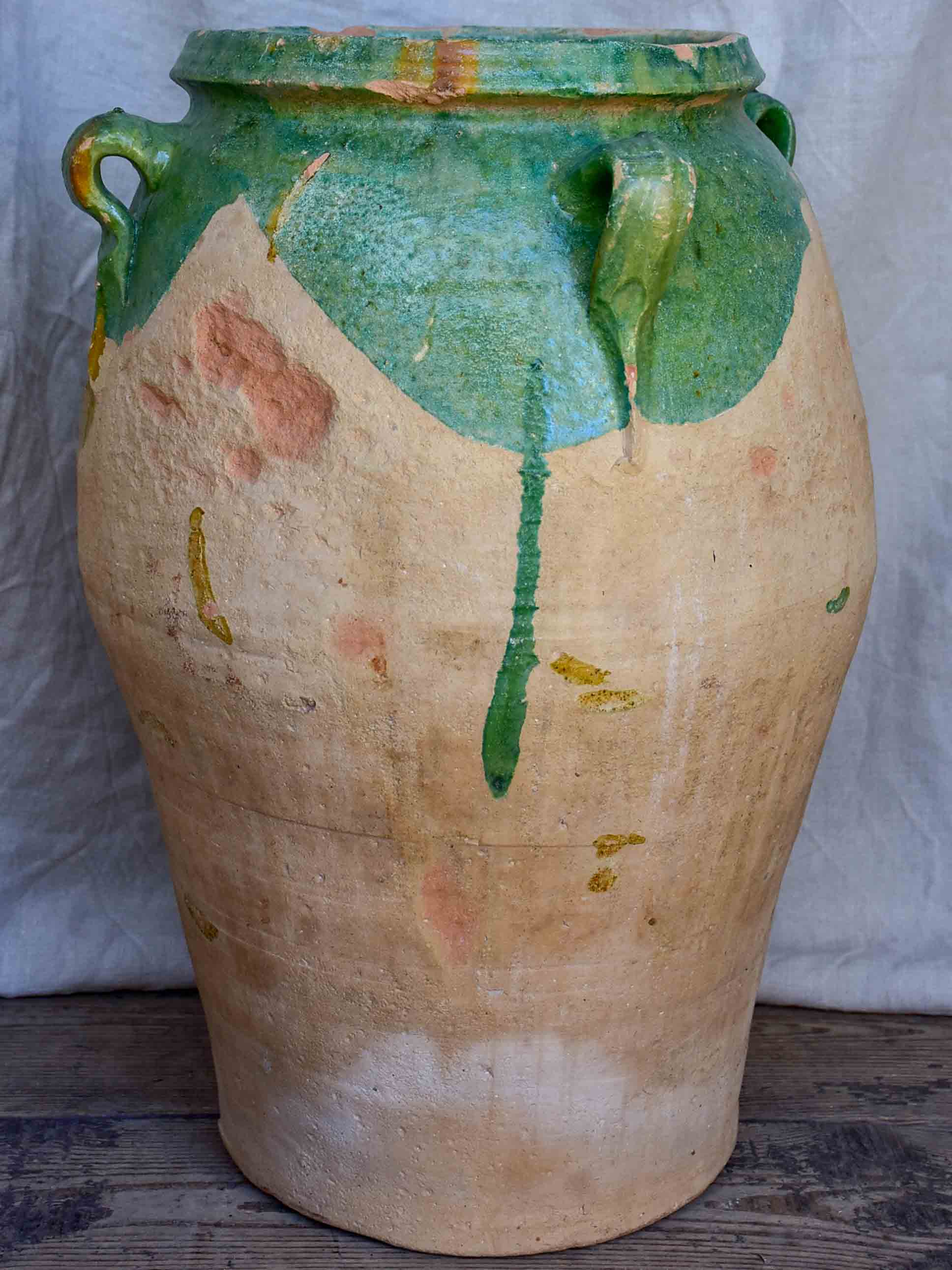 Antique French amphora pot with green glaze and four handles