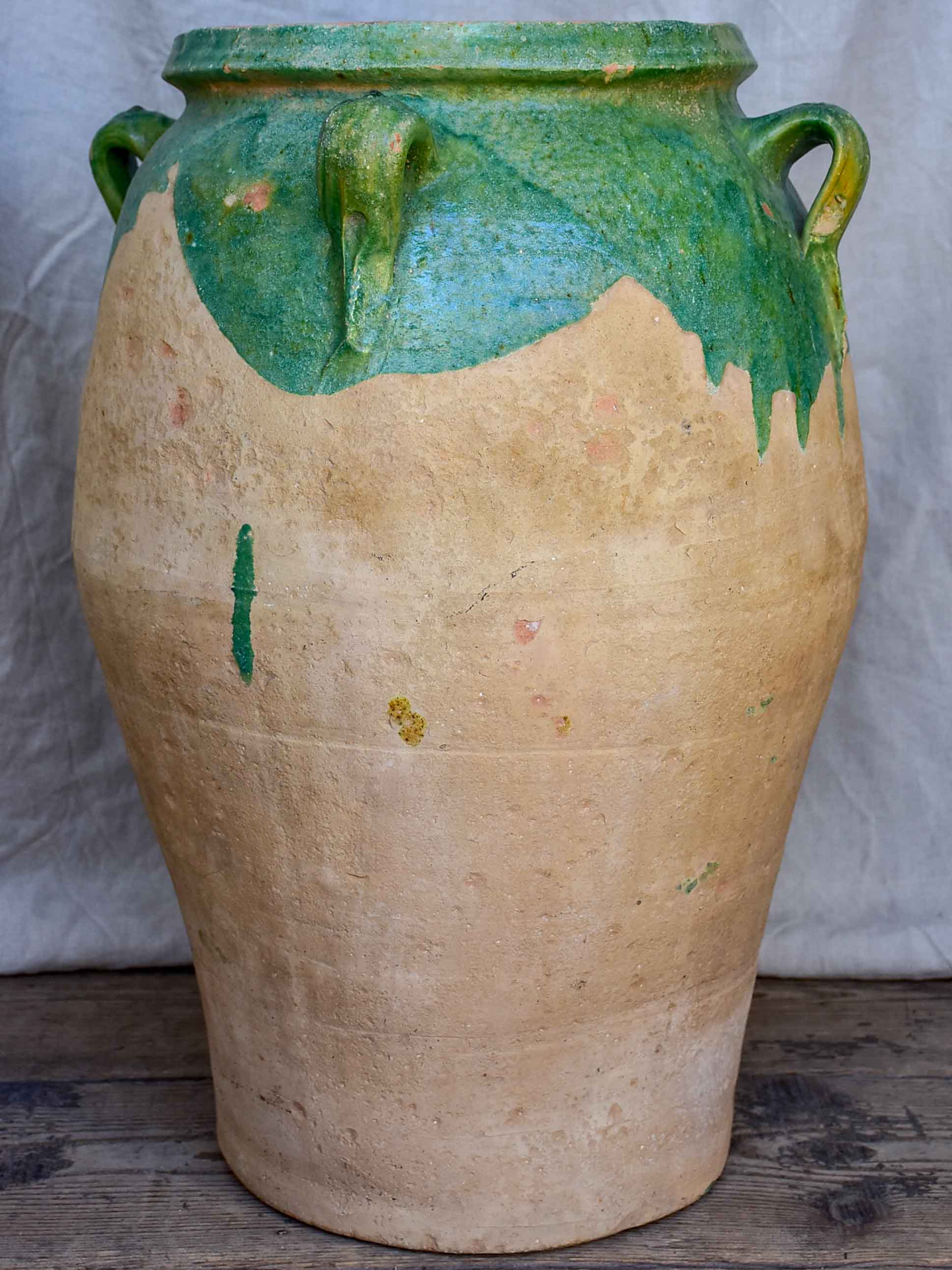 Antique French amphora pot with green glaze and four handles