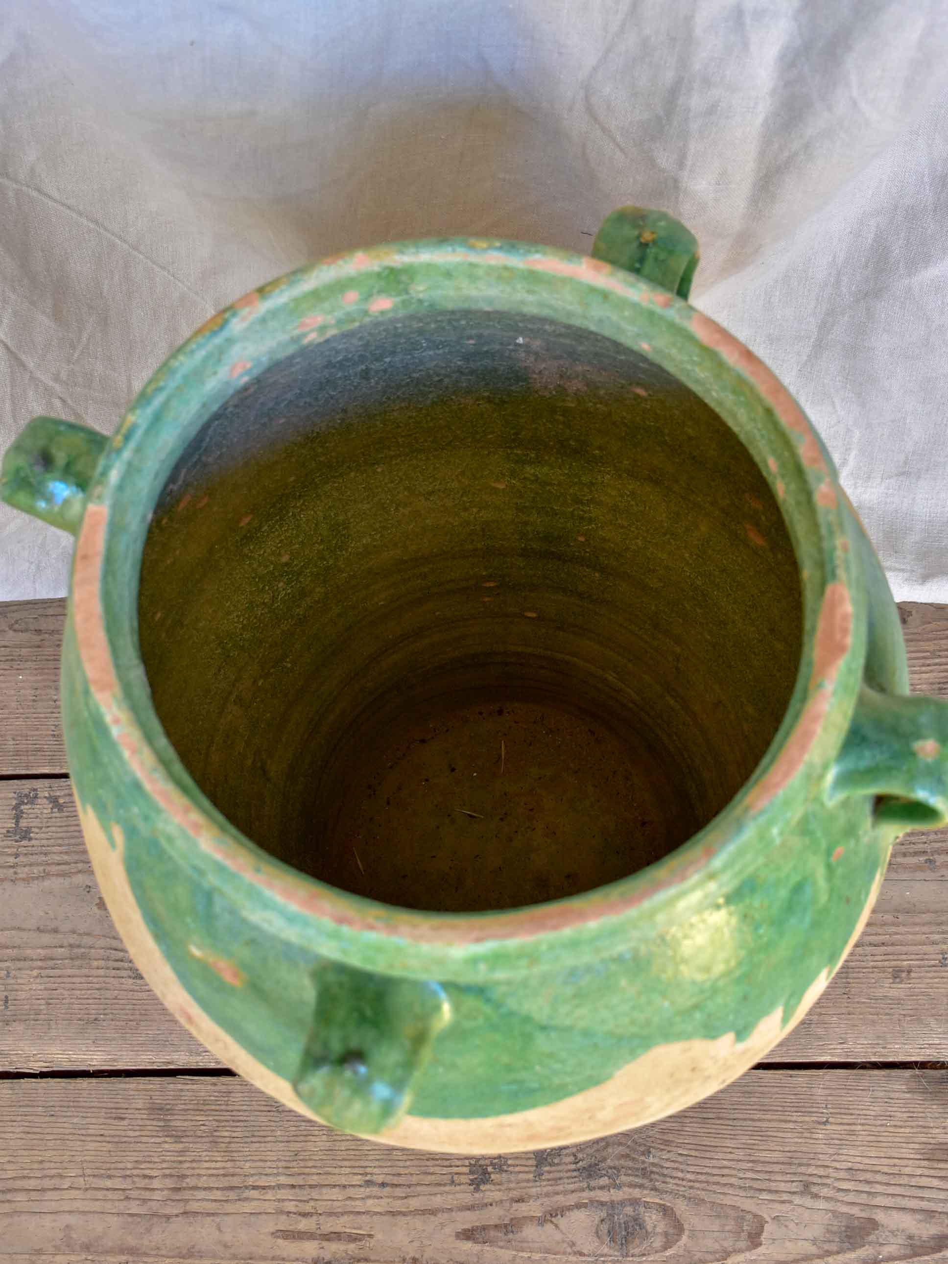 Antique French amphora pot with green glaze and four handles