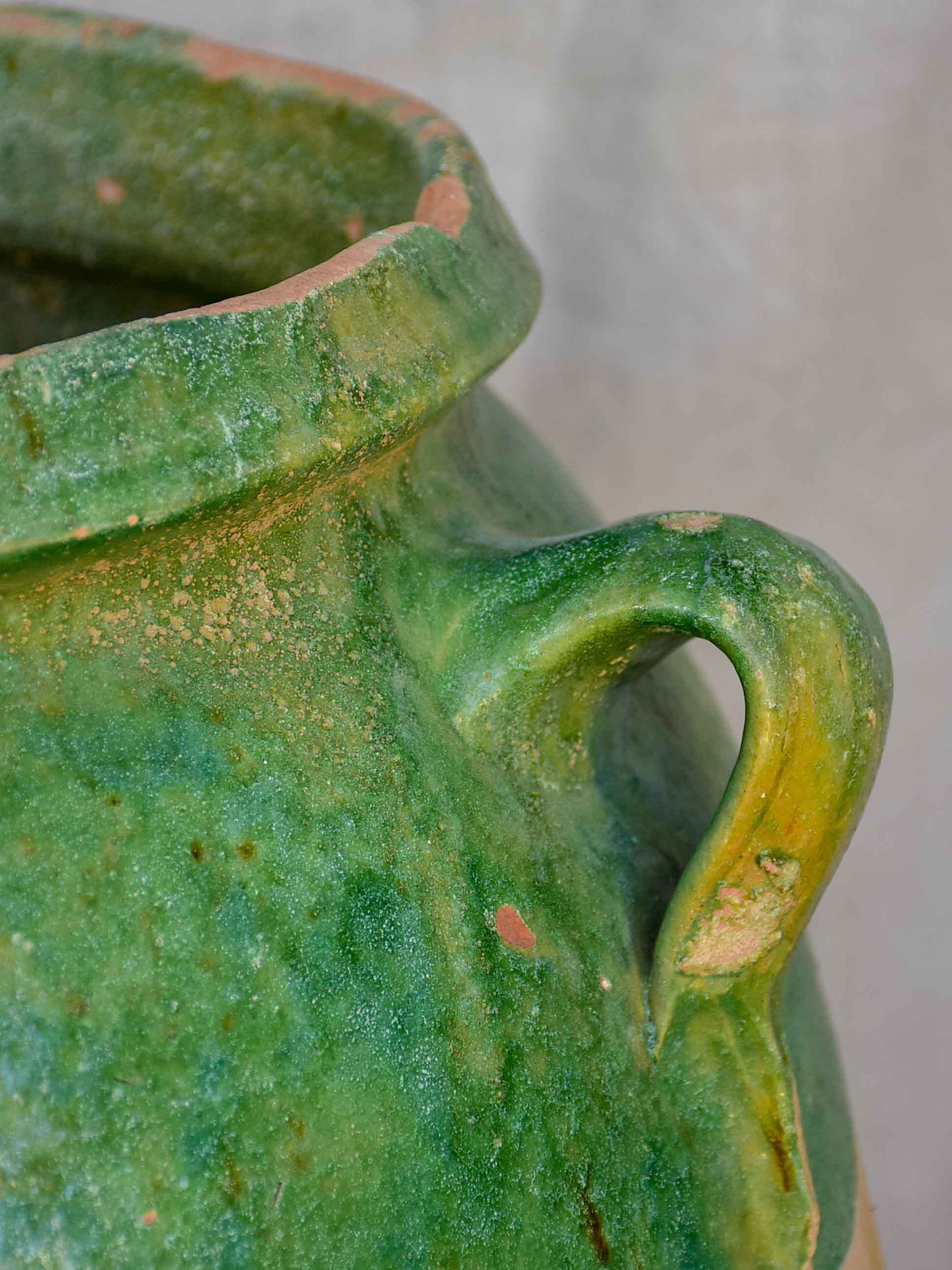 Antique French amphora pot with green glaze and four handles