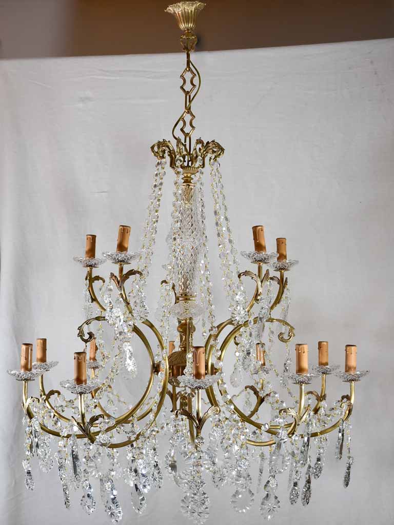 Pair of large crystal and brass chandeliers with 15 lights from the 1940's 35½" diameter