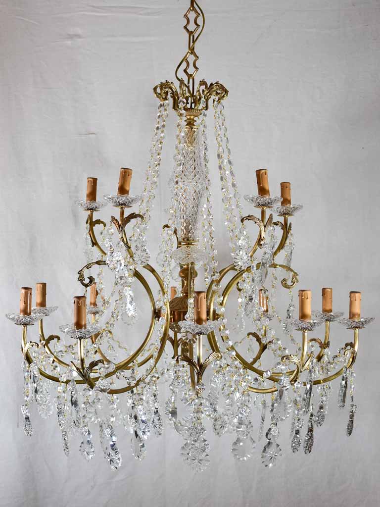 Pair of large crystal and brass chandeliers with 15 lights from the 1940's 35½" diameter