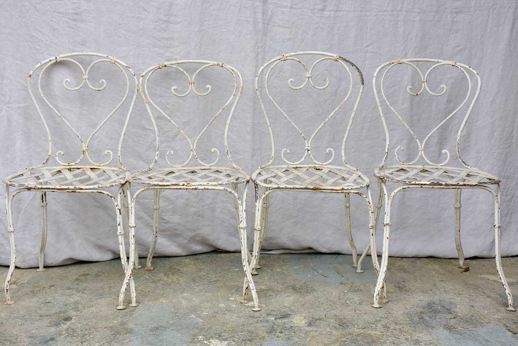 Four antique French garden chairs with heart back and lattice seat