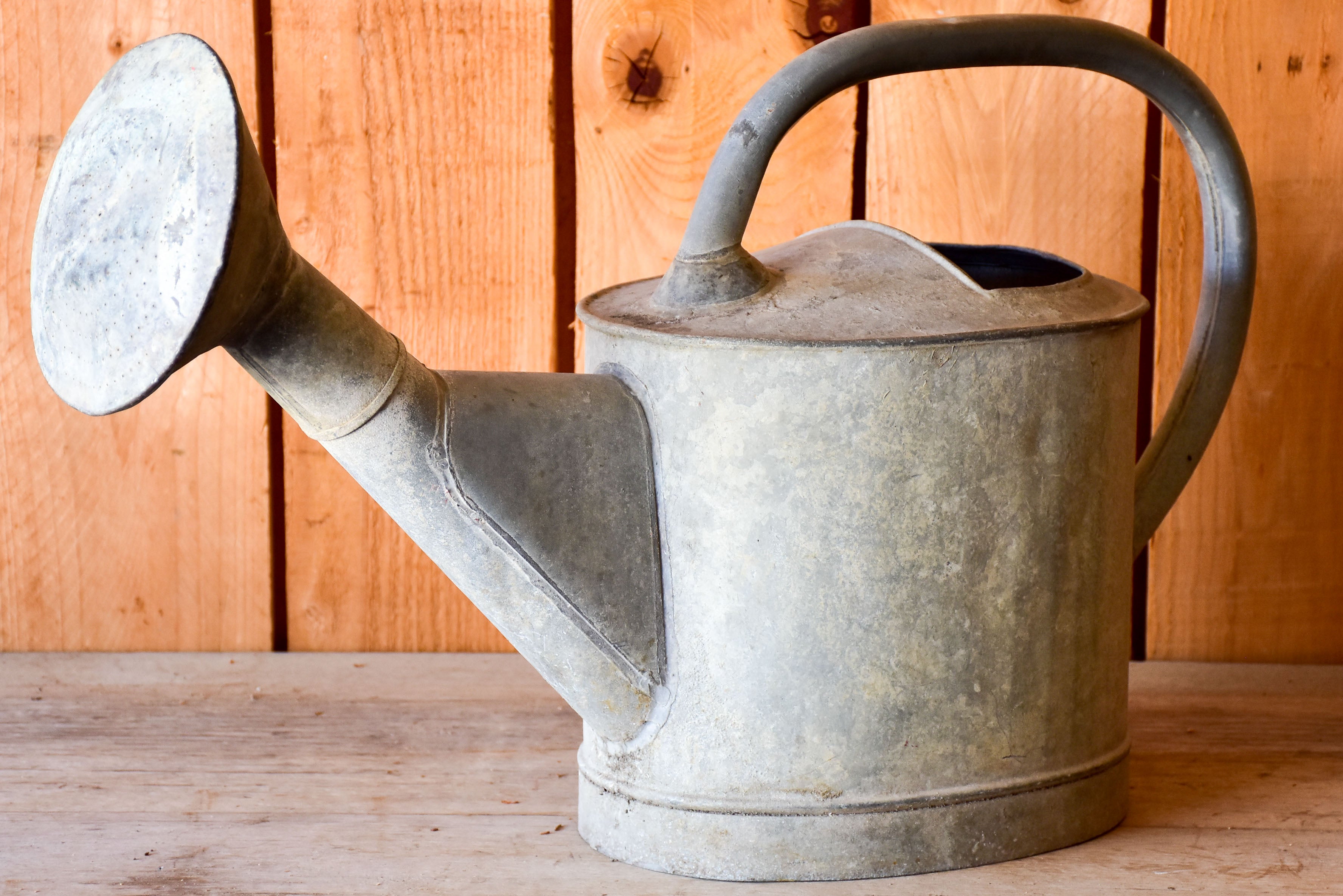 Antique French watering can with large rose head