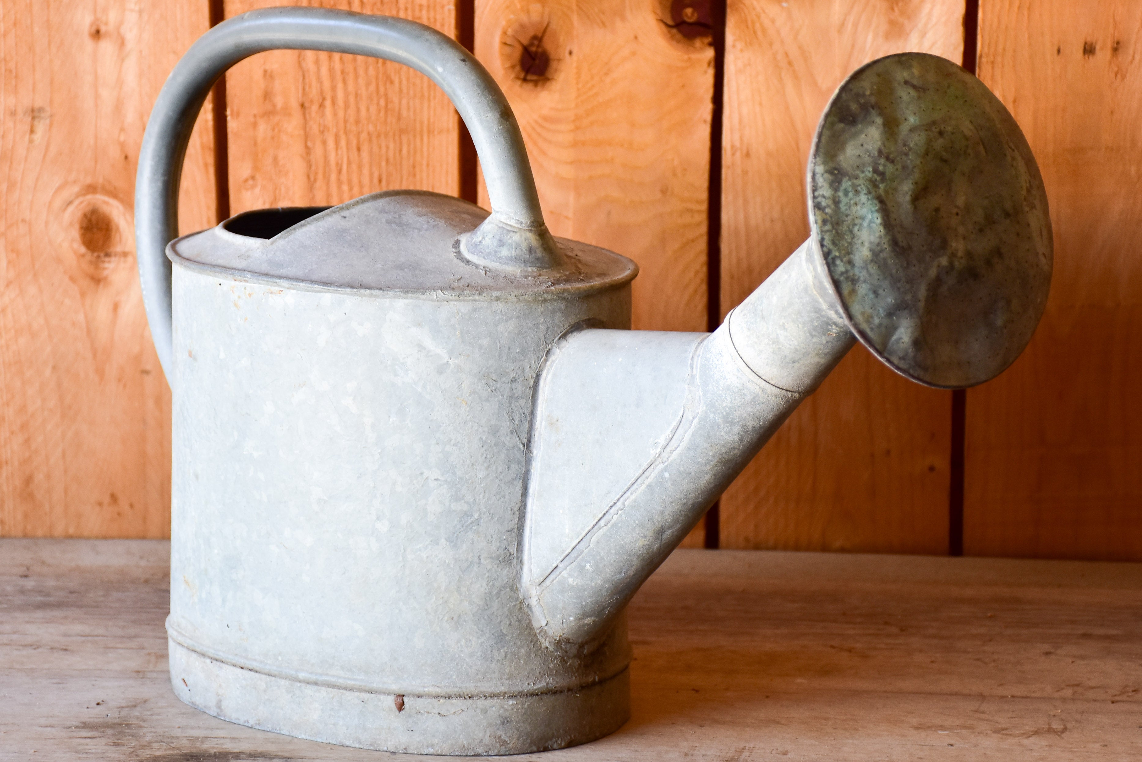 Antique French watering can with large rose head