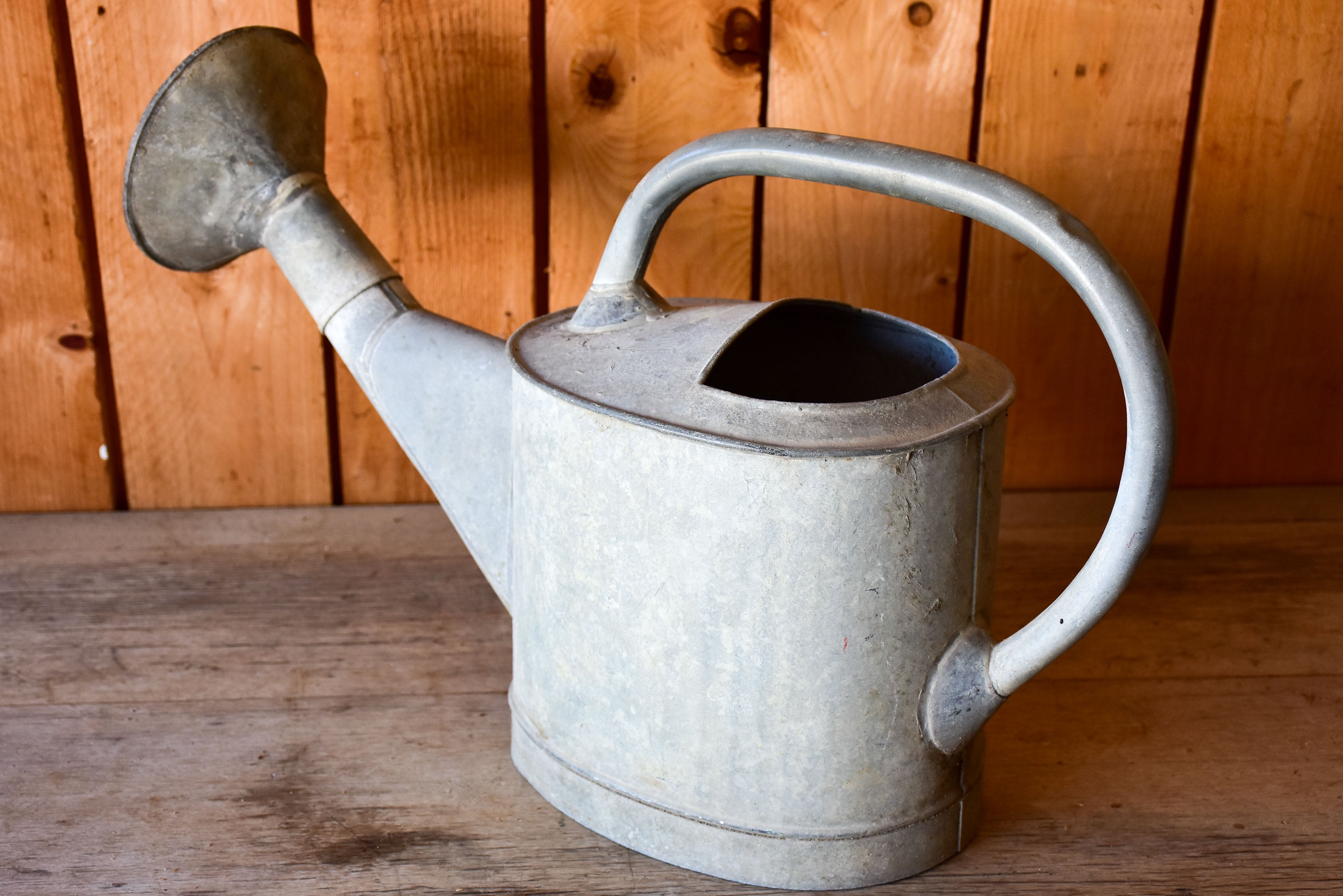 Antique French watering can with large rose head