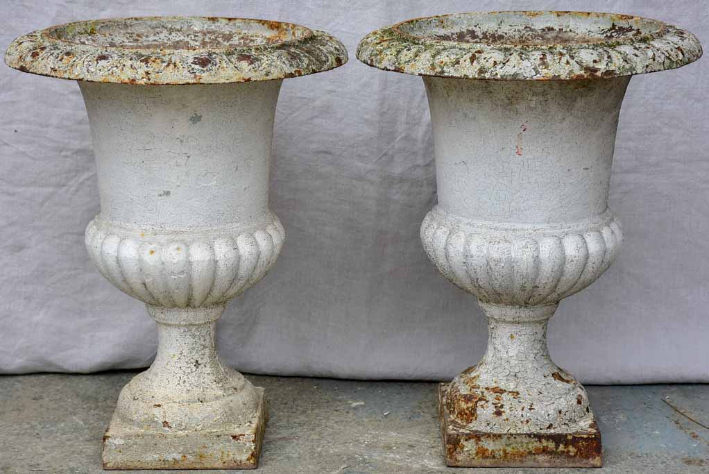 Pair of antique French cast iron Medici urns - white