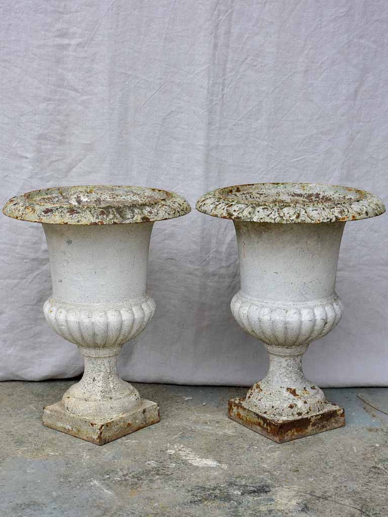 Pair of antique French cast iron Medici urns - white