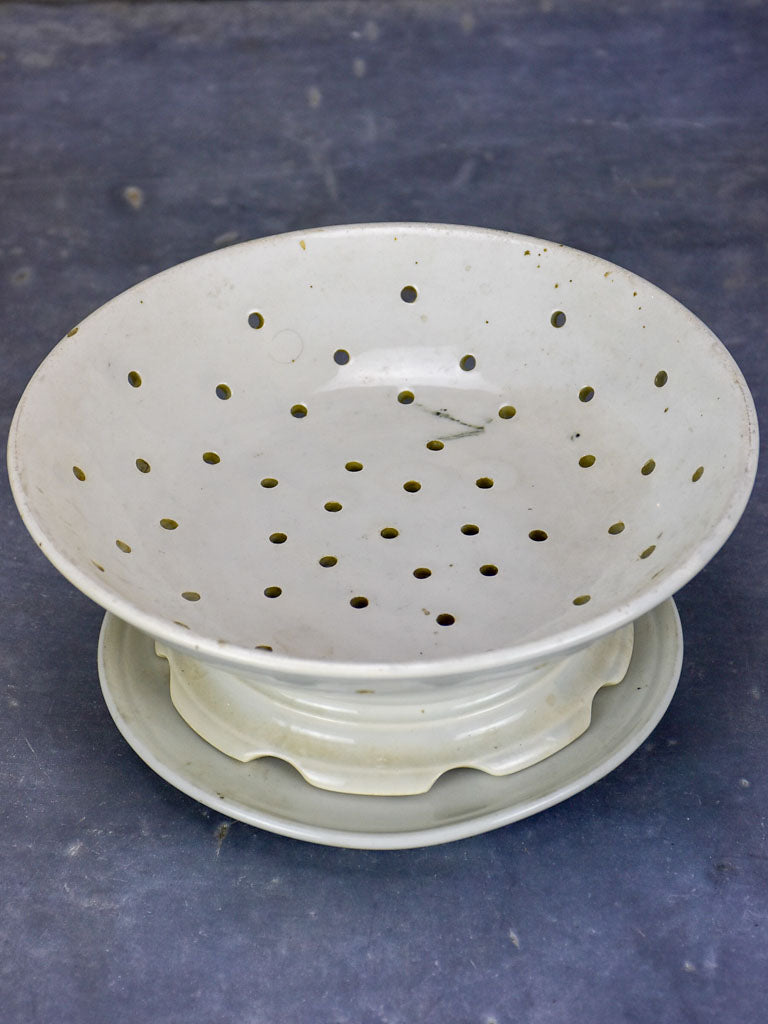 Antique French fruit strainer with catchment plate underneath