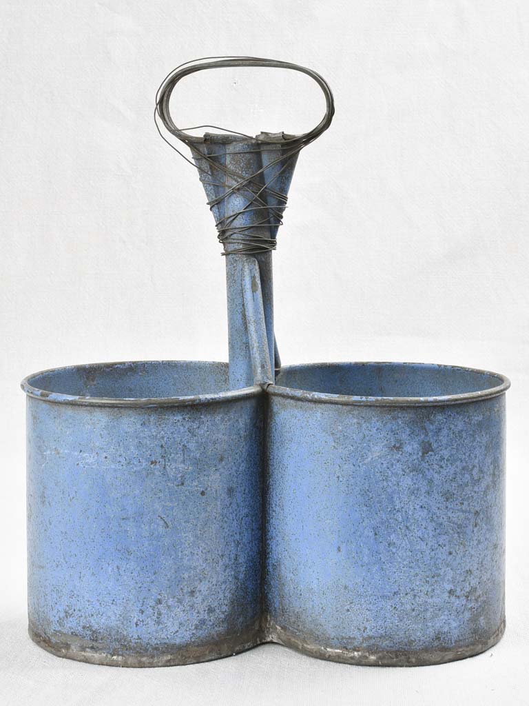 Antique bottle carrier with blue patina