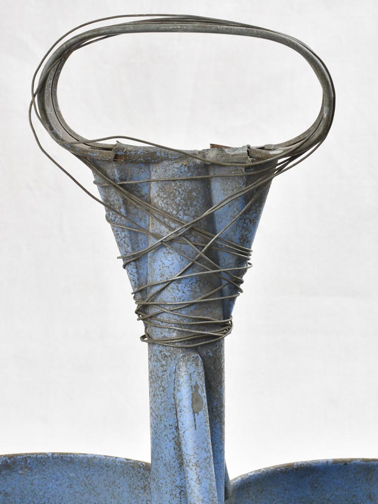 Antique bottle carrier with blue patina