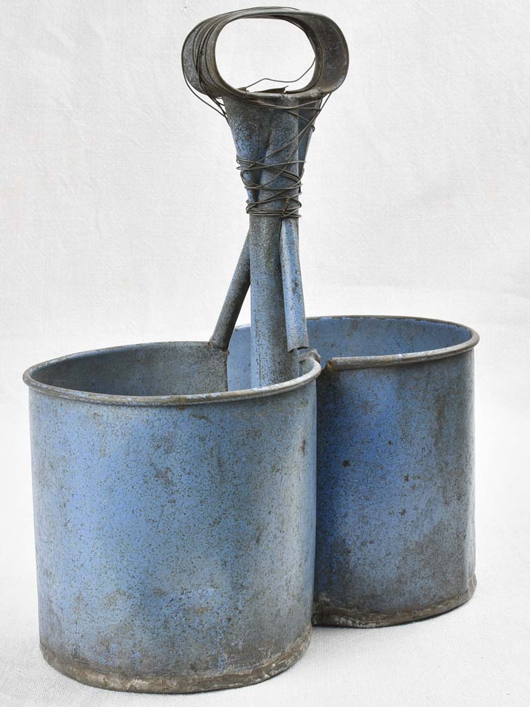 Antique bottle carrier with blue patina