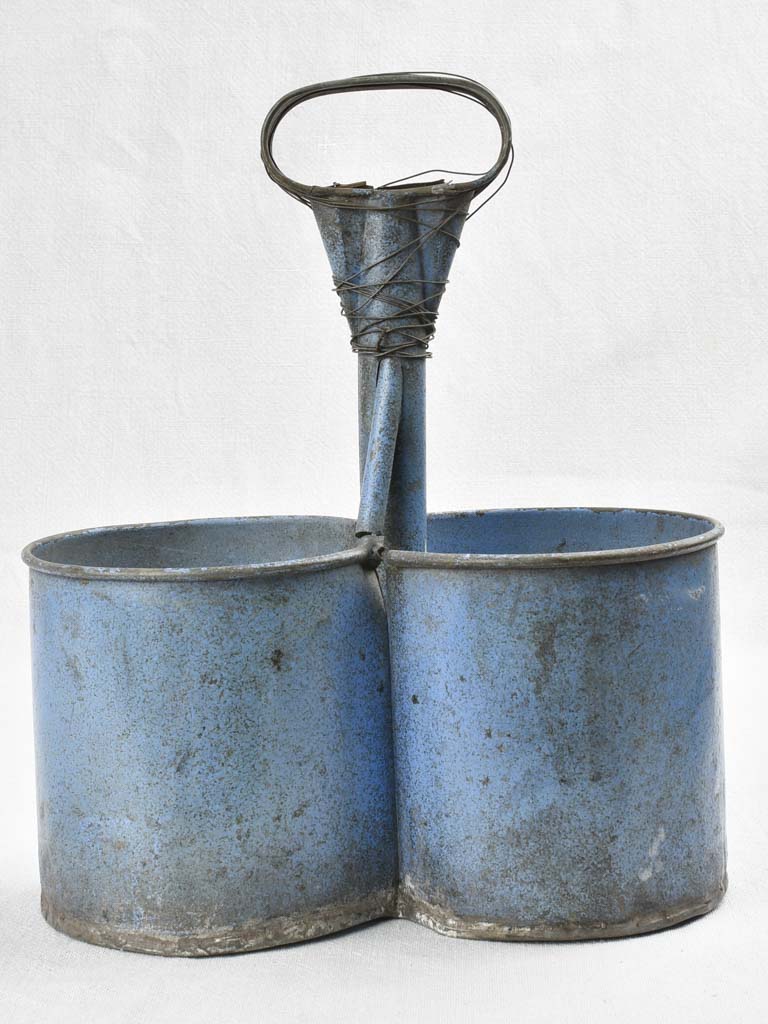 Antique bottle carrier with blue patina