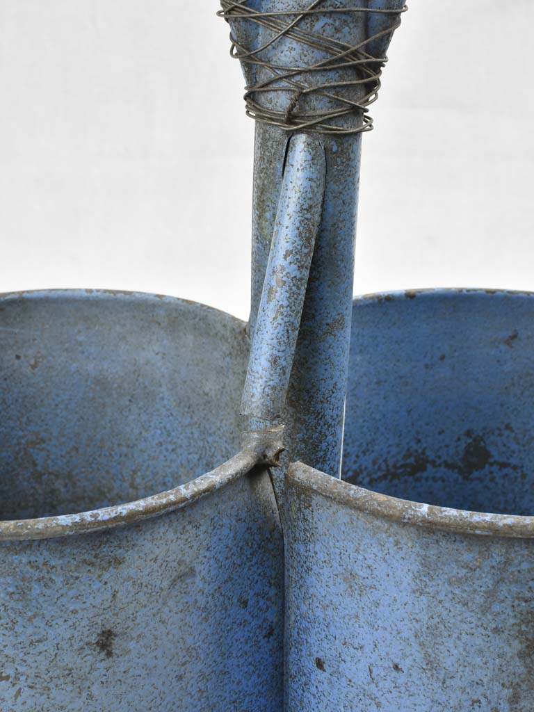 Antique bottle carrier with blue patina