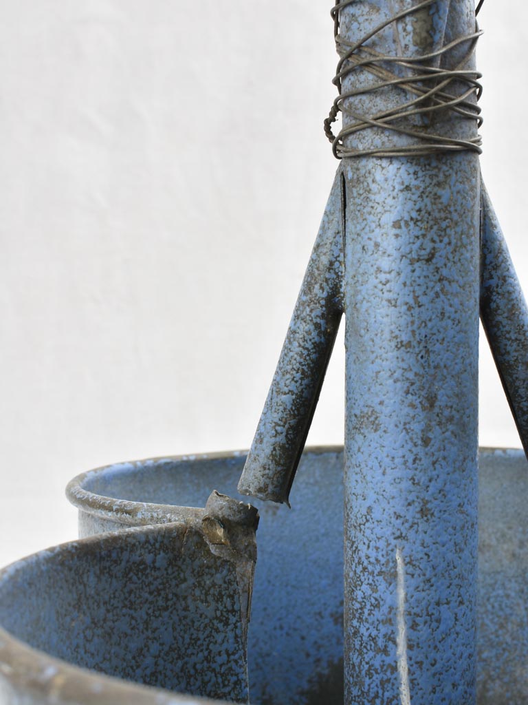 Antique bottle carrier with blue patina