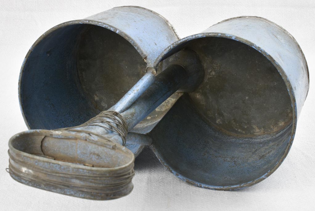 Antique bottle carrier with blue patina